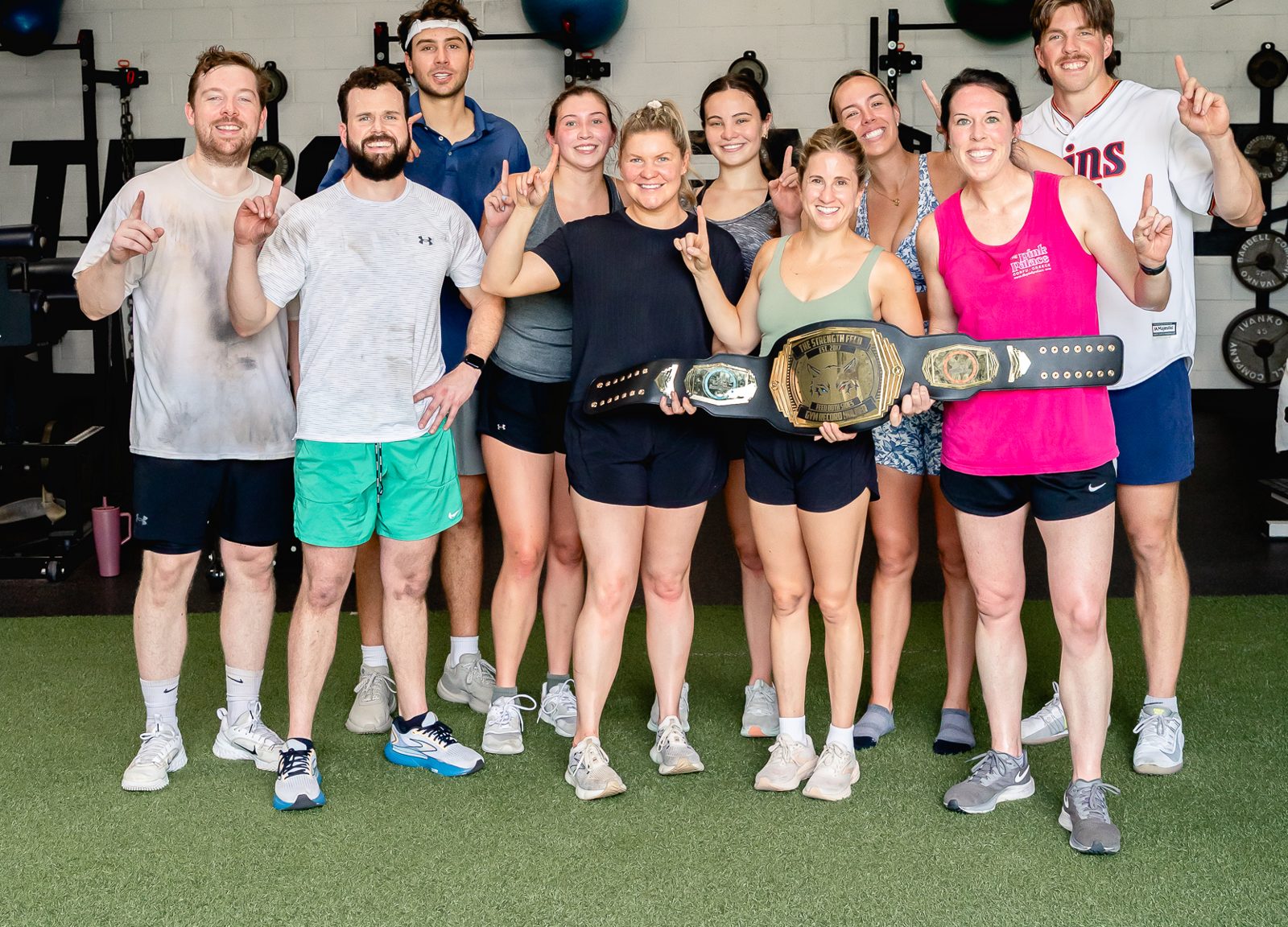 Adult members of The Strength Feed celebrating together in Raleigh